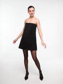 Minimal black A-line silk dress by MOSAÏKA worn on model front view
