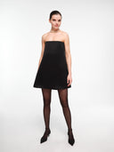 Black A-line silk dress by MOSAÏKA styled with necklace on model