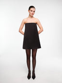 Black A-line silk dress by MOSAÏKA styled with necklace on model
