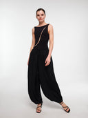 Black balloon trousers by MOSAÏKA styled with pearl wave bodysuit on model