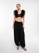 Black balloon trousers by MOSAÏKA full look with feather top