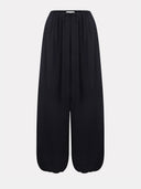 Black balloon trousers by MOSAÏKA full length front view
