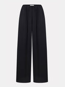 Black balloon trousers by MOSAÏKA relaxed wide-leg silhouette