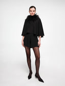 Feather boa collar by MOSAÏKA styled with black mini dress creating a dramatic lightweight silhouette