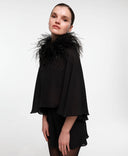 Feather boa collar by MOSAÏKA styled on model creating expressive neckline with soft feather movement