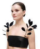Goose feather straps by MOSAÏKA styled on model shoulder with strapless top
