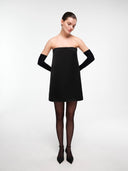 Black A-line dress by MOSAÏKA worn by model on a light background