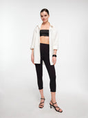 Oversized white shirt layered over leggins base outfit — MOSAÏKA styling system