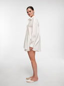 Oversized white shirt layered over modular base outfit — MOSAÏKA styling system