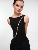 Black Pearl Wave bodysuit by MOSAÏKA worn on model with flowing trousers