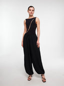 Black Pearl Wave bodysuit by MOSAÏKA worn on model with flowing trousers