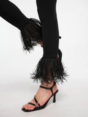 Black leggings by MOSAÏKA detail of removable raffia trim at hem