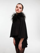 Black silk cape set by MOSAÏKA close-up with feather statement straps