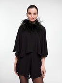Black silk cape set by MOSAÏKA worn with feather statement straps front view