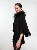 Black silk cape set by MOSAÏKA worn with feather straps side view