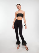 Black strapless crop top by MOSAÏKA worn on model angled pose highlighting structure
