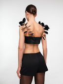 Black tailored mini shorts by MOSAÏKA back view on model