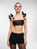 Black tailored mini shorts by MOSAÏKA worn on model full body front view